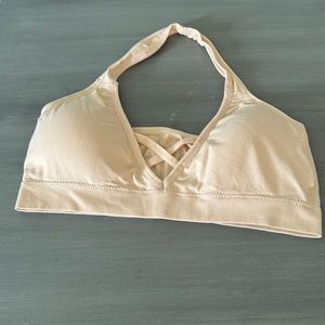 Brand new from Temu. I ordered the wrong size.  Light padding w/ halter straps.